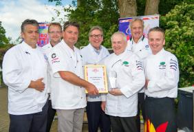 Image of BBQ champion Graham Crump with Ray Hall and judges