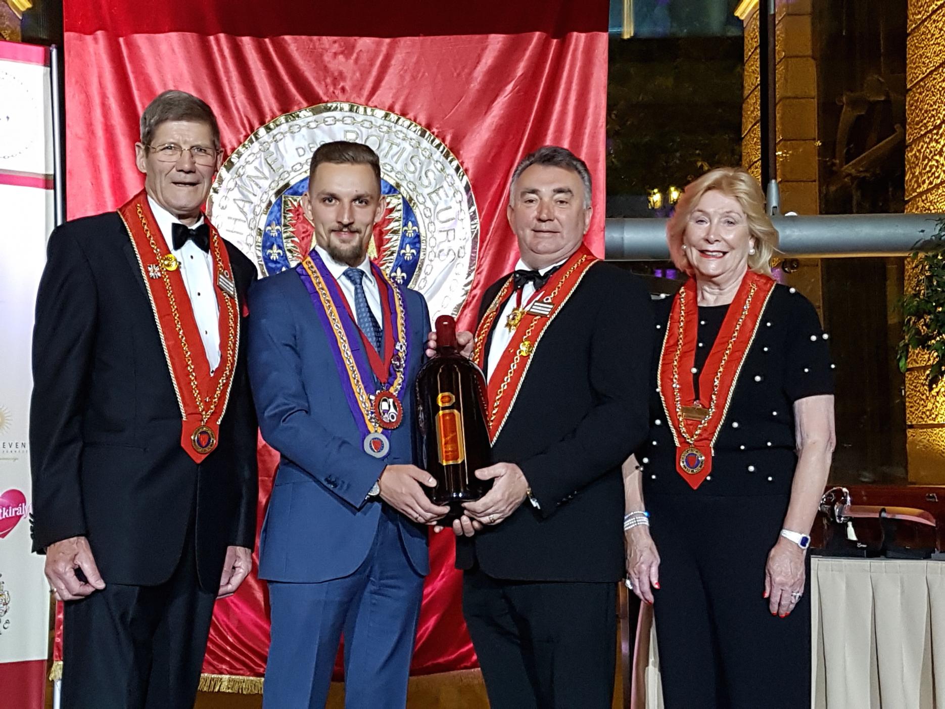International finals (L – R) – Phillip Evins (Bailli Délégué for the UK, Chaîne des Rôtisseurs), Piotr Pietras (winner of International Young Sommelier of the Year), Bryan Julyan (chief executive of the Court of Master Sommeliers) and Marie Jones (international vice president, Chaîne des Rôtisseurs).