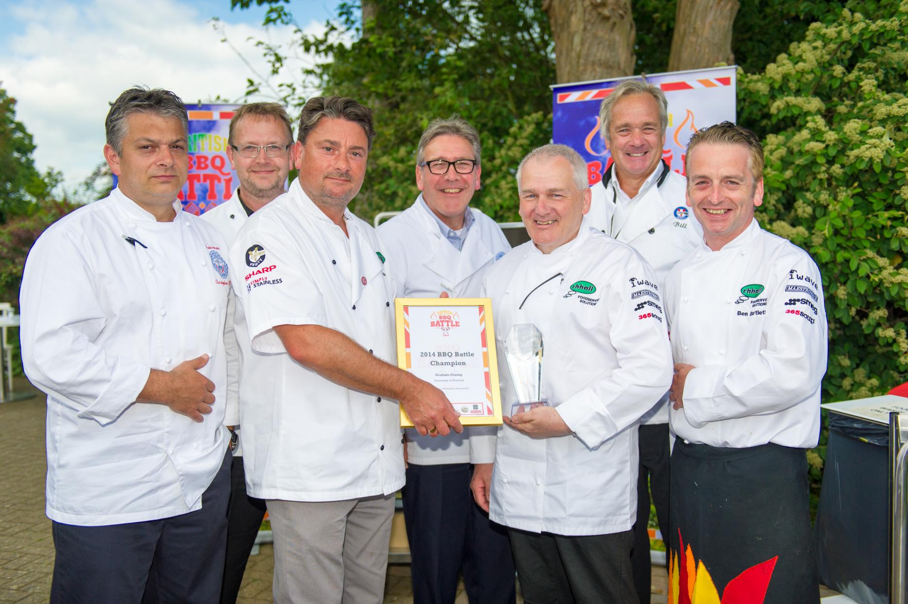 BBQ champion Graham Crump with Ray Hall and judges Image of BBQ champion Graham Crump with Ray Hall and judges