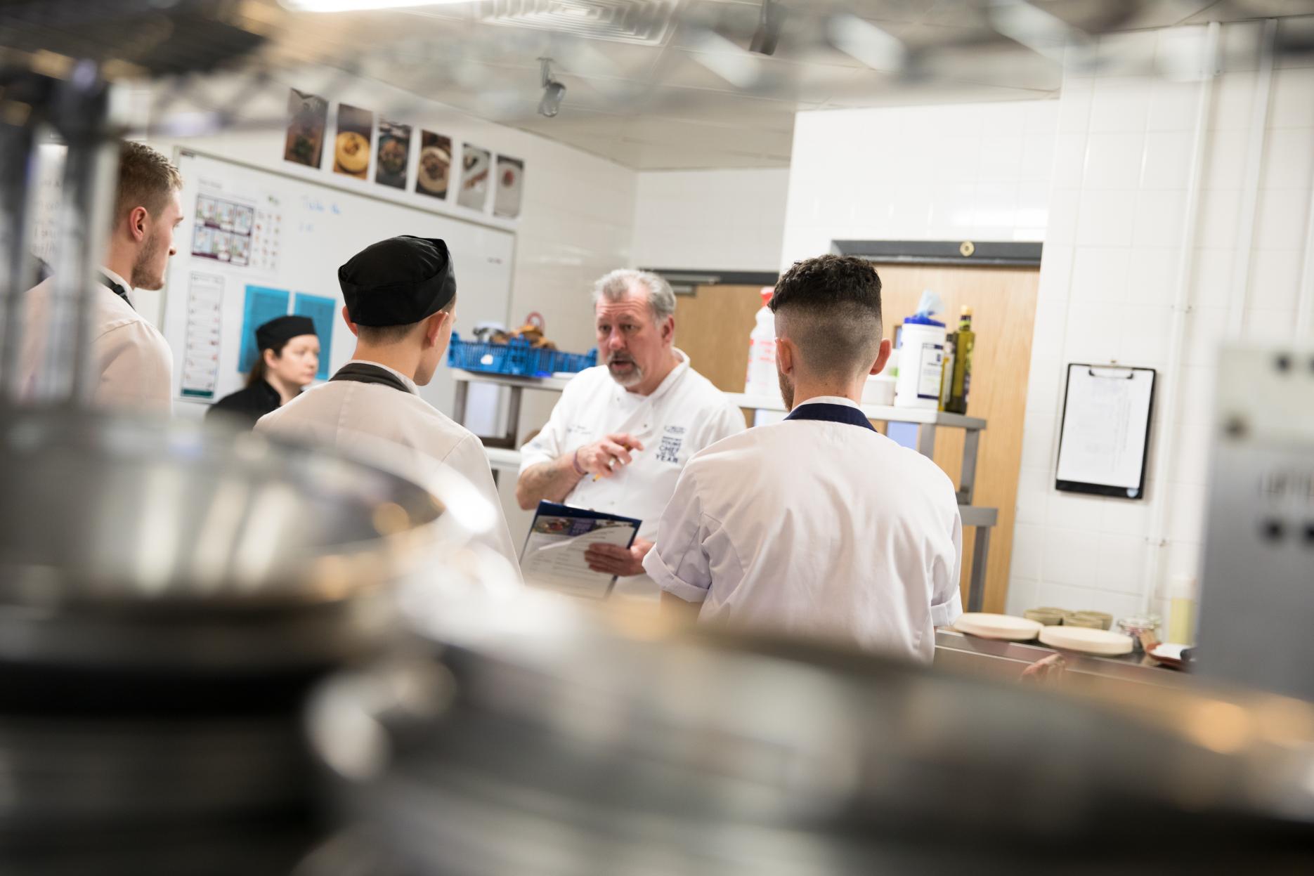 Chairman of judges chef Brian Mellor with former contestants