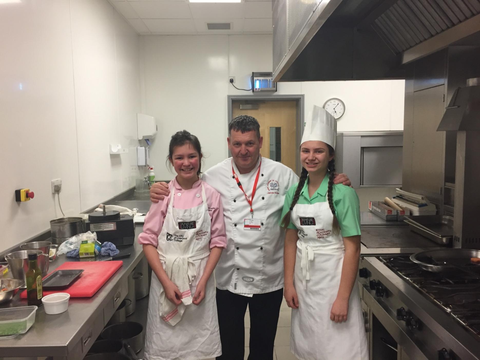 Molly Garber and Lucy Mae D’arcy with James Holden The City of Liverpool College joins Adopt a School scheme