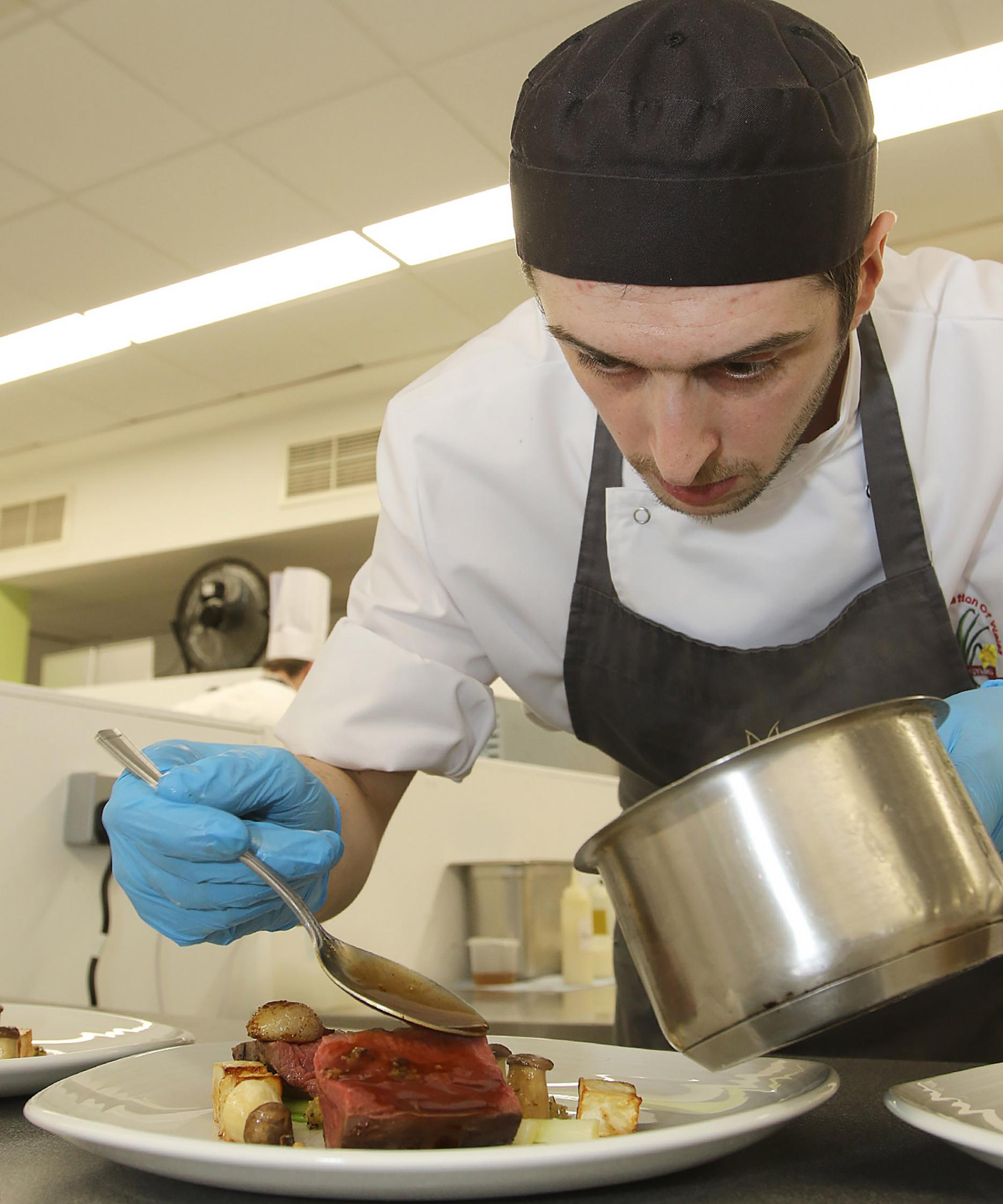 Last year’s Junior Chef of Wales winner, Steffan Davies, during the final.